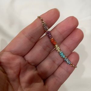 Adjustable gold colorful bracelet.